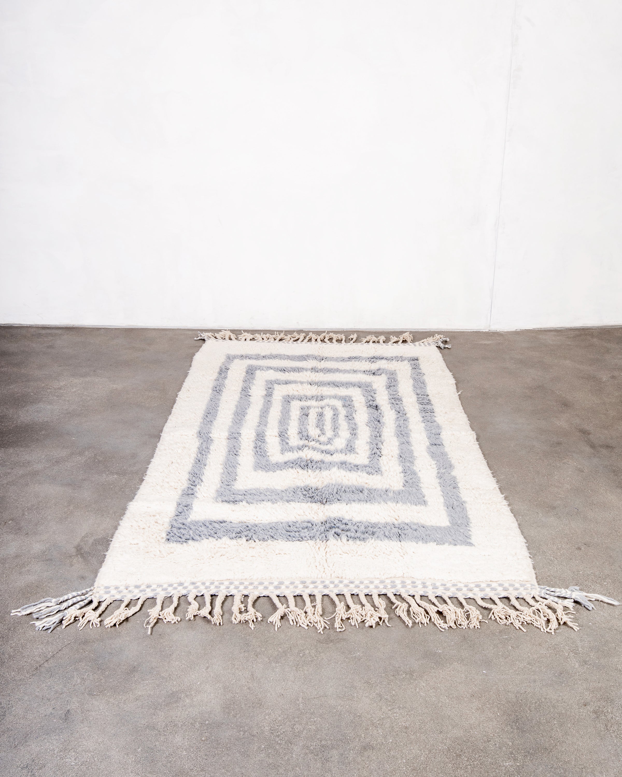 Modern, designer, handcrafted Berber rug from Morocco. Beniourain carpet with beautiful colors and patterns and fluffy wool texture.